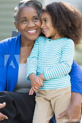 Happy grandmother and granddaughter hugging