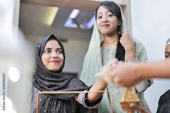 Happy Indian Muslim family celebrating Eid Mubarak and Having Eid Feast at Home