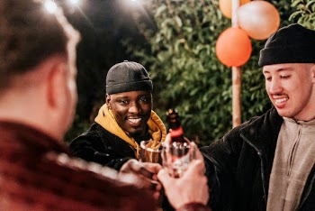 Happy male friends toasting to celebrate | Free Photo - rawpixel