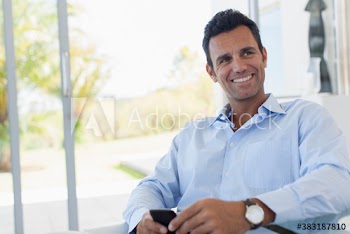 Happy man using smart phone