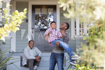 Happy multi-generation men on front stoop