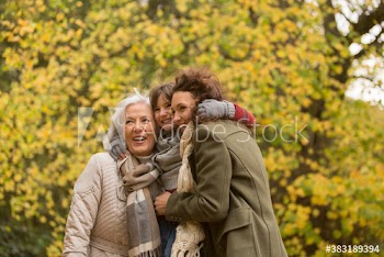 Happy multi-generation women in autumn park