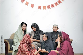 Happy Muslim family celebrating Eid Mubarak
