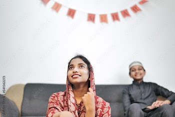 Happy Muslim family celebrating Eid Mubarak