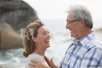 Happy senior couple on beach