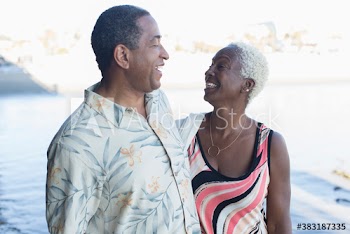 Happy senior couple on beach