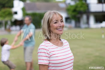 Happy senior woman in backyard