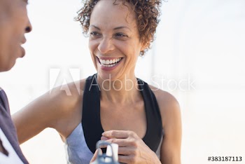 Happy senior woman talking with friend