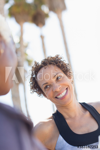 Happy senior woman talking with friend