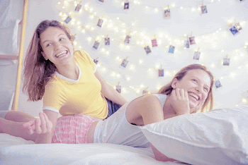 Happy sisters chilling in bed, | Free Photo - rawpixel