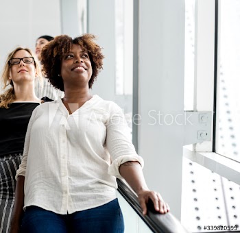 Happy woman in an escalator