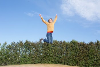 Happy Woman Jumps On Trampoline