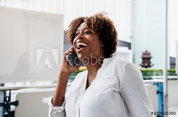 Happy woman talking on the phone