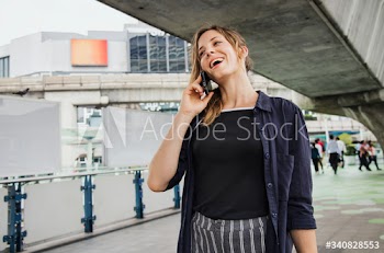 Happy woman talking on the phone