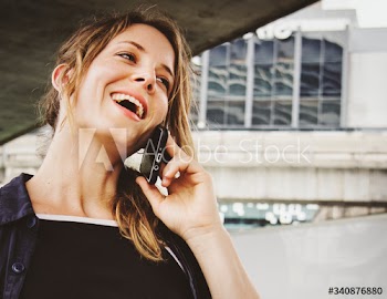 Happy woman talking on the phone