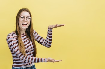 Happy woman wearing glasses with copy space Free Photo