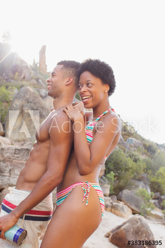 Happy young couple in bathing suits on vacation