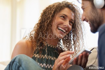 Happy young couple with smart phone