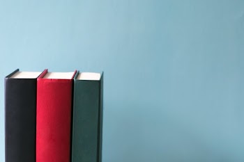 Hard Cover Books On Blue Background