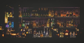 HDR photo of wine bottles in shelf
