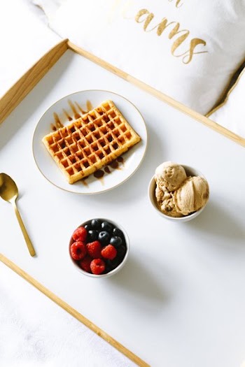 Healthy And Indulgent Food In Bed