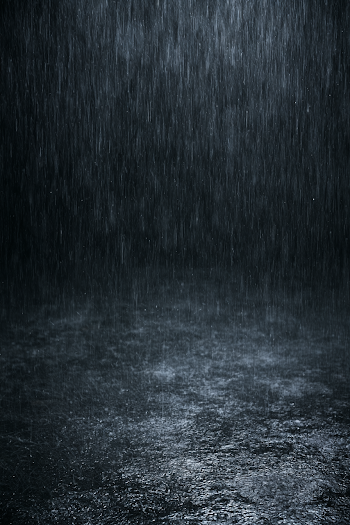 Heavy Rainfall Against a Dark Background