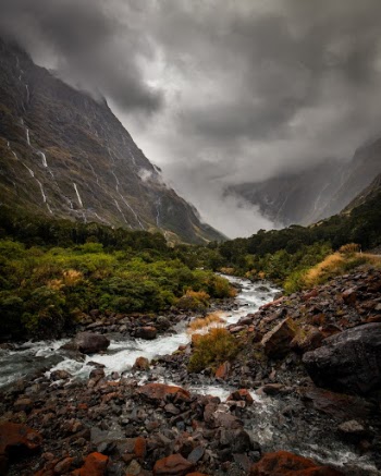 Heavy rains pour into the valley of Milford Sound, New Zealand. 