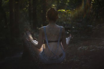 Helios shot of a girl meditating