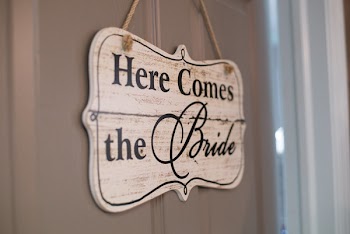 Here Comes the Bride Door Signage in Selective Focus Photography