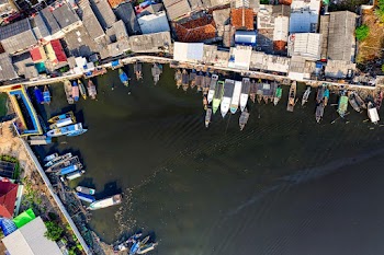 High Angle Photo of Boats on Body of Water