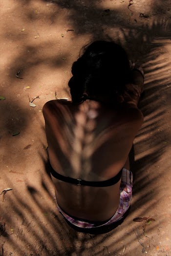 High Angle Photo of Person Sitting on Sand