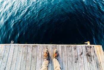 High-Angle Photo of Person Wearing Sneakers