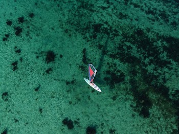 High Angle Photo of Sail Boat on Water