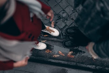 High-Angle Photo of Two People Wearing Shoes