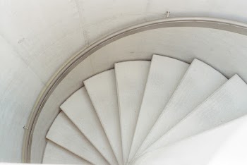 High Angle Photo of White Spiral Staircase