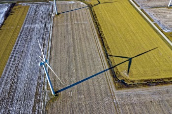 High Angle Photo of Wind Turbine on Field