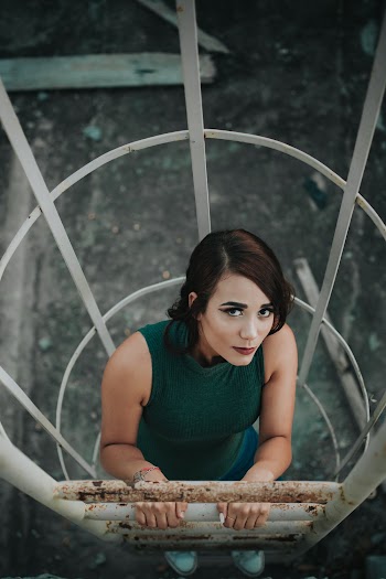 High-Angle Photo of Woman Climbing on Ladder