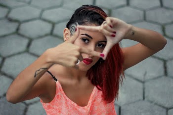 High Angle Photo of Woman Doing Hand Sign