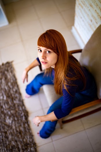 High-Angle Photo of Woman Sitting on Chair