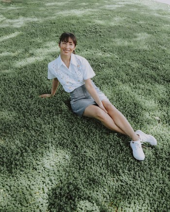 High-Angle Photo of Woman Sitting on Grass