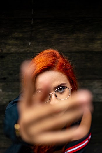 High-Angle Photo of Woman Wearing Eyeglasses