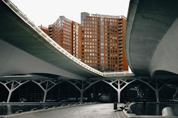 high-angle photography of brown concrete building under white sky