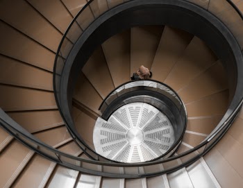 High-angle Photography of Brown Spiral Stair