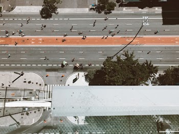 High Angle Photography of People on Road Near Building