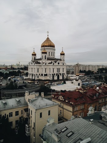 High-angle Photography of White and Brown Concrete Building Under White Sky
