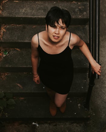 High-angle Photography of Woman on Stairs