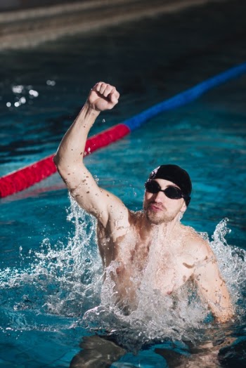 High angle sportsman celebrating victory Free Photo