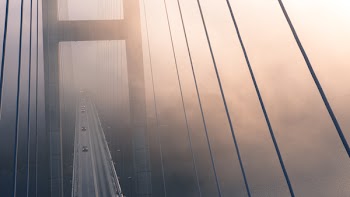 High Angle View of Suspension Bridge Against Sky