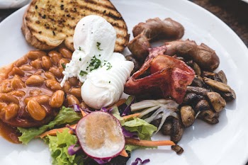 High protein brunch with poached eggs, beans and bacon 