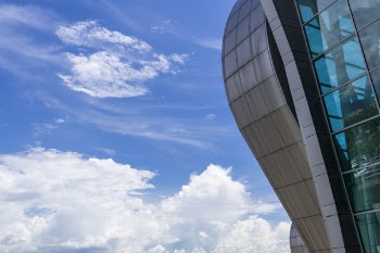 High-rise Building Under Blue Sky and White Clouds